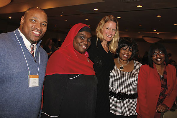Members of Minority Students in Action stand with President Merodie Hancock at the annual Student Academic Conference. Second from left is Layla Abdullah-Poulos, founder 
of the MSiA club.