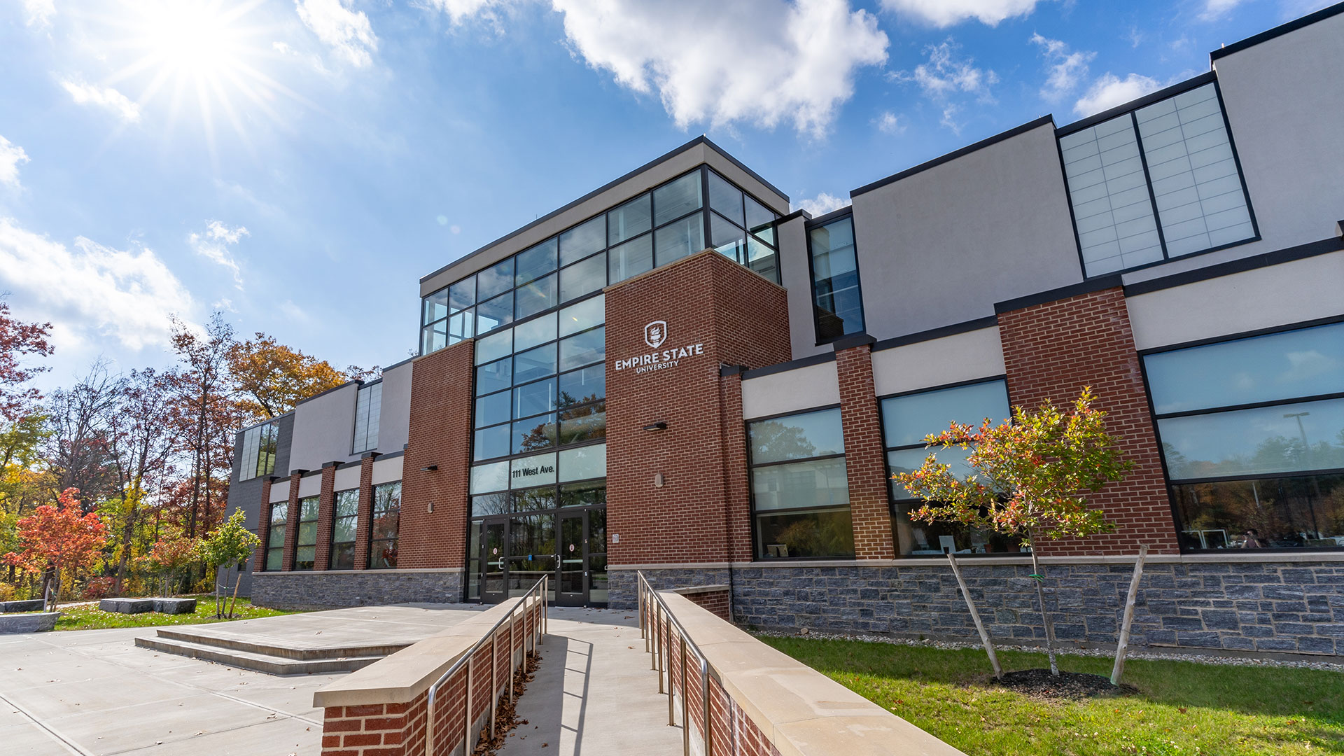 Teams background of the exterior of suny empires 111 west avenue location